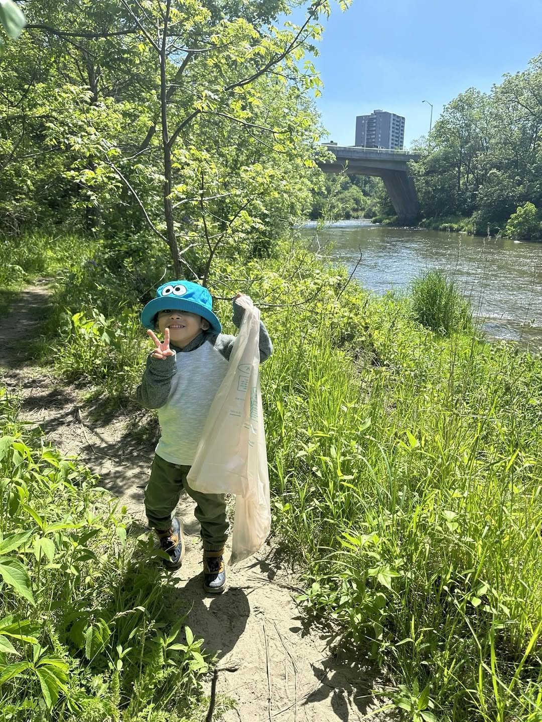 Humber River Pals volunteer collecting litter along the riverbank